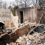 What was once a tornado safe room is about all that was left of a house in the aftermath of wildfires the day before in Stillwater, Saturday, March 15, 2025.
