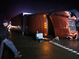 1 of 101 Mark Nelson, of Wis., waits with his tractor-trailer after it overturned during high winds and a possible tornado on Interstate 44 westbound at Villa Ridge, Mo., Friday, March 14, 2025. (Robert Cohen/St. Louis Post)